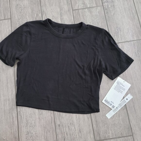 lululemon athletica Tops - Lululemon Hold Tight Short Sleeve Black Tee Size 8 NWT